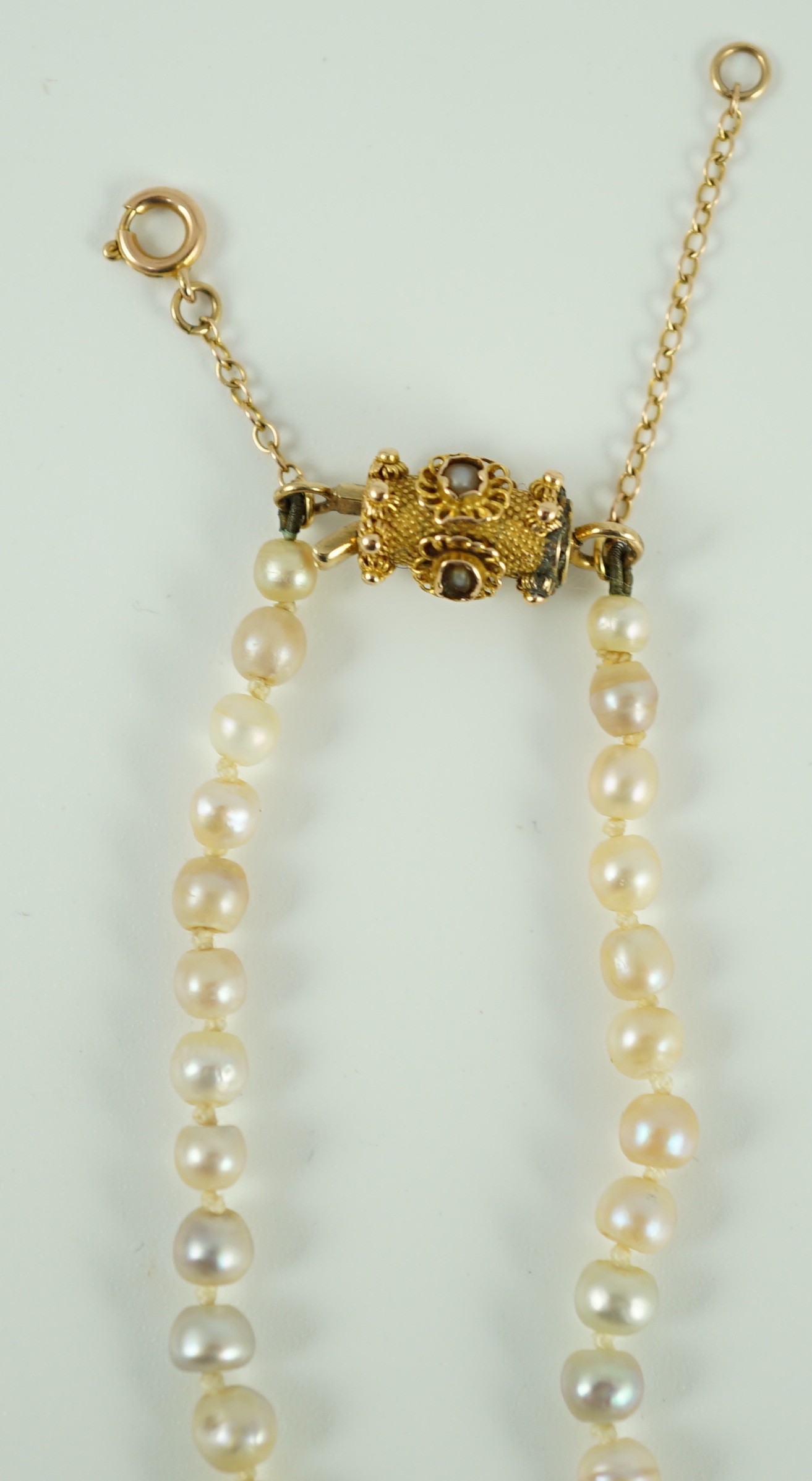 A single strand graduated natural saltwater pearl necklace